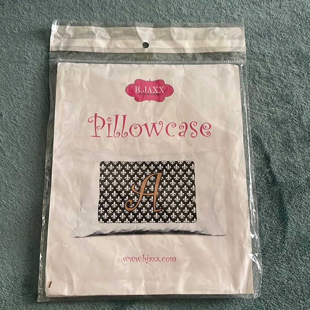 New in Package.. standard size pillowcase with initial “S”